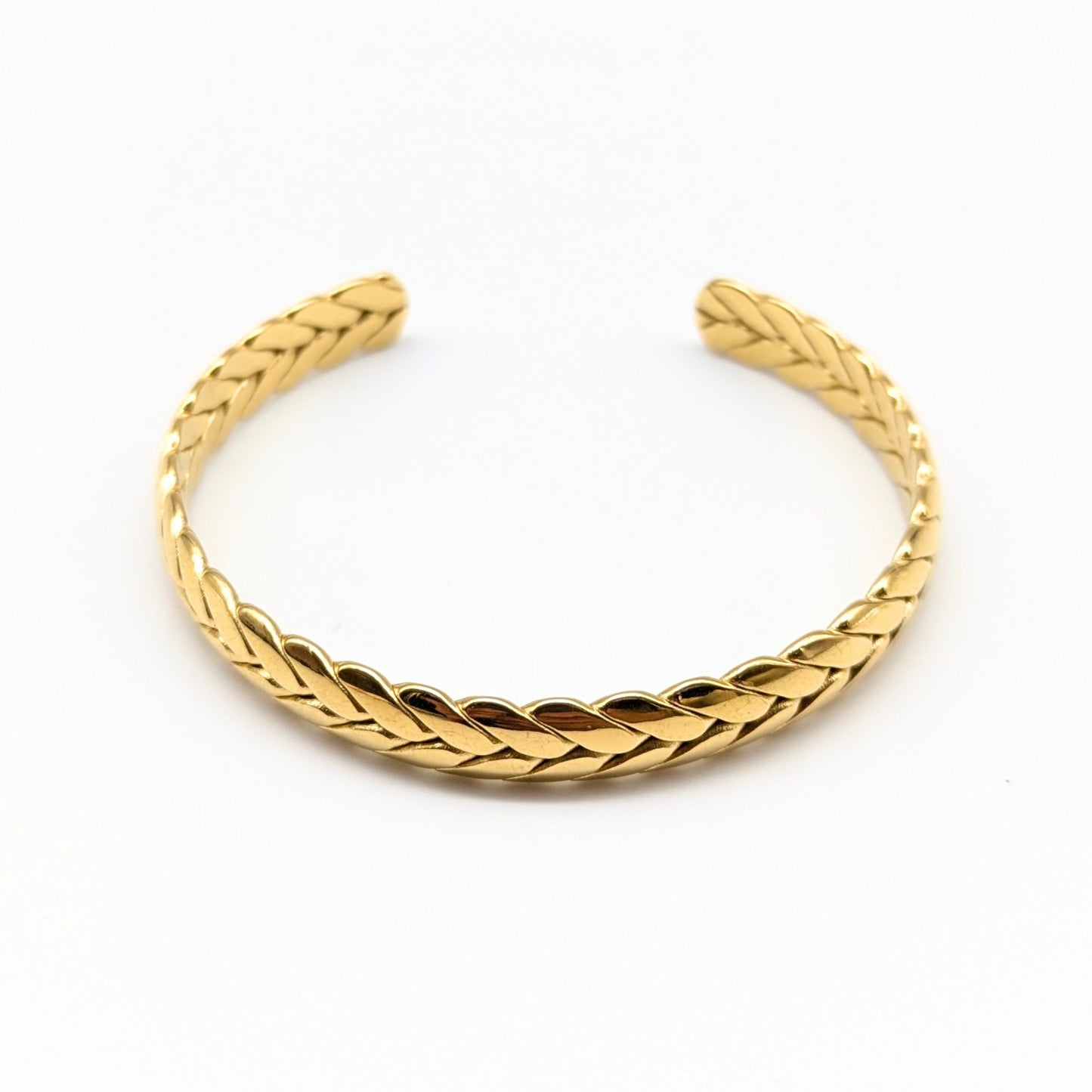 Braided gold cuff bracelet in polished finish