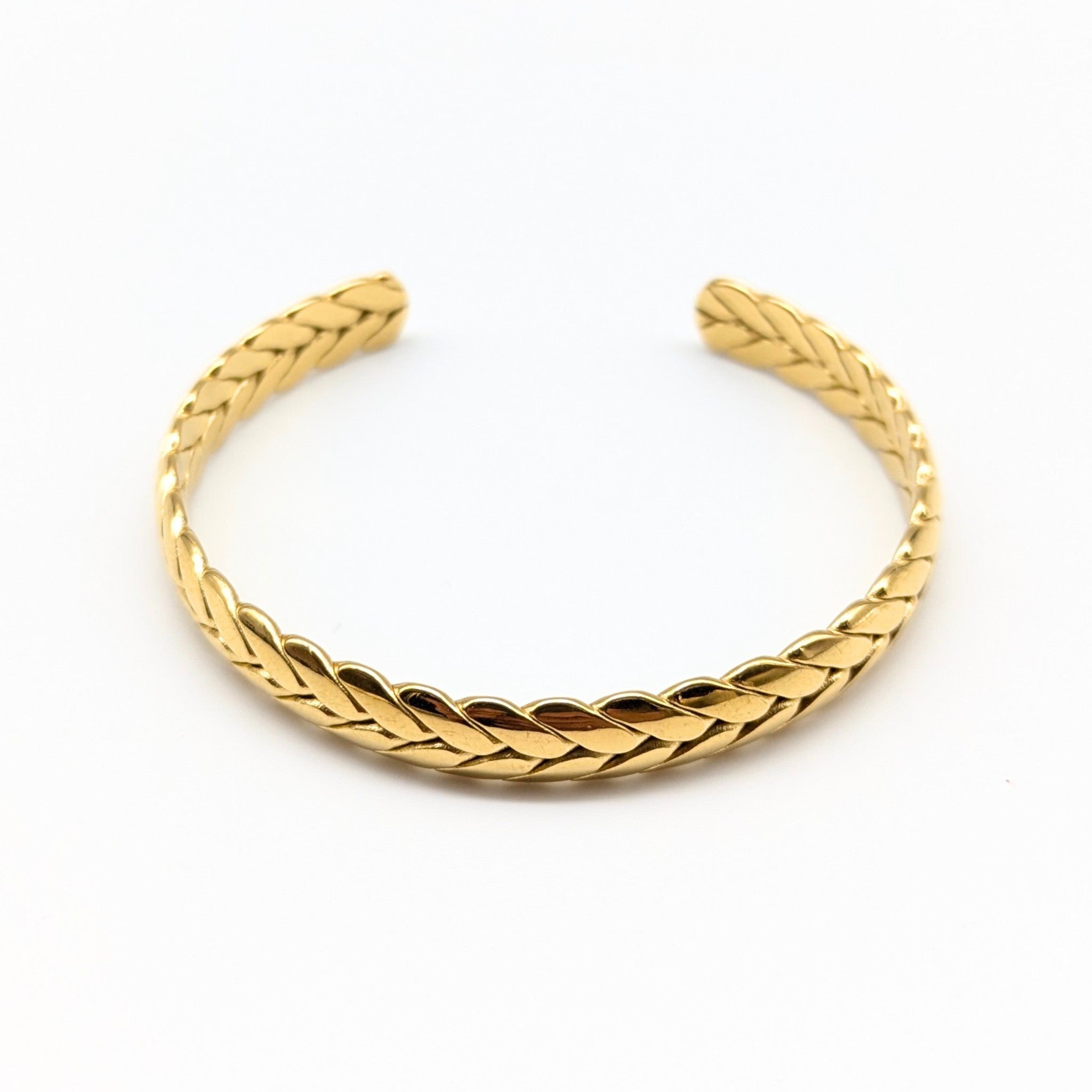 Braided gold cuff bracelet in polished finish