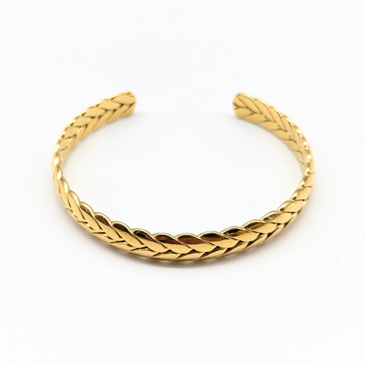 Braided gold cuff bracelet in polished finish
