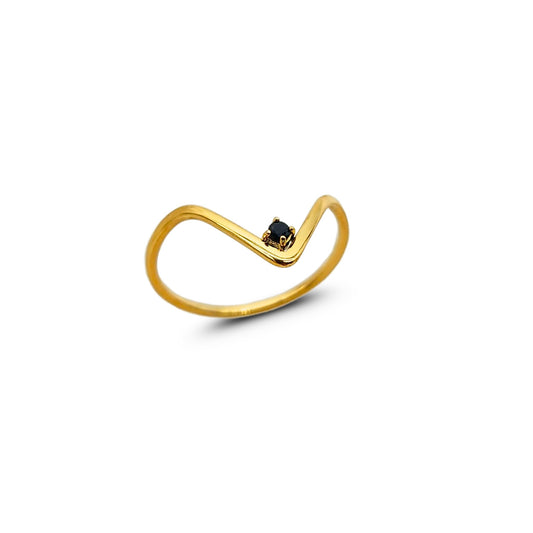 Gold V stacking ring with small black onyx stone, isolated on white background