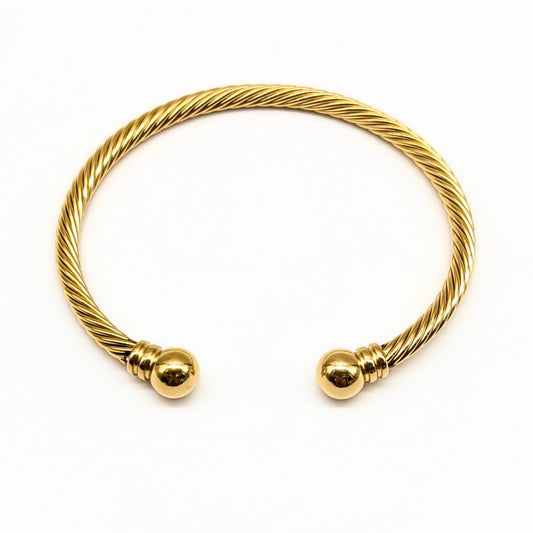 Gold cable cuff bracelet with polished dome ends