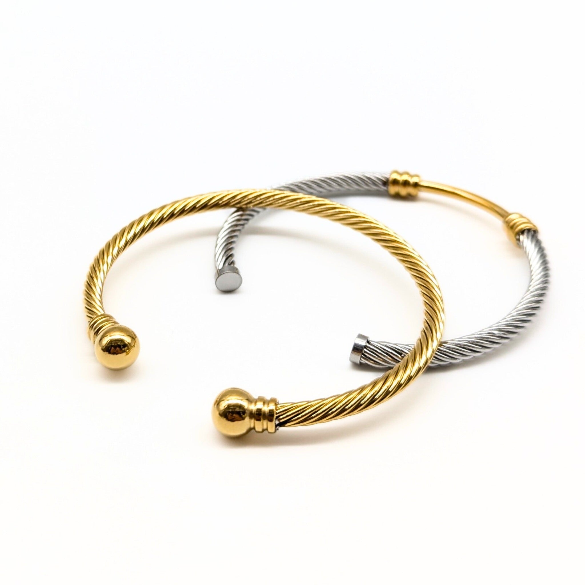 Gold and silver cable cuff bracelets styled together