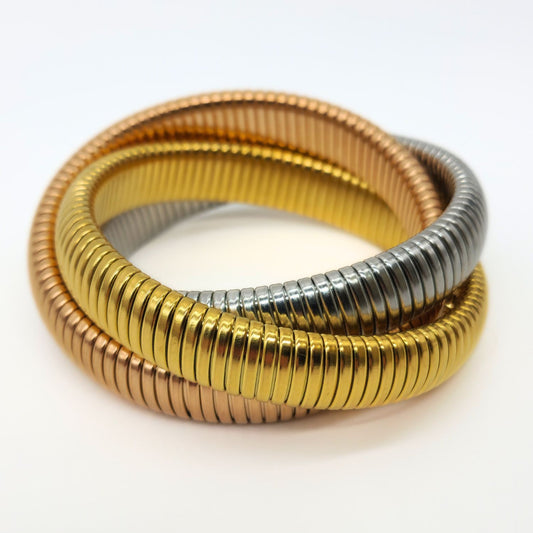Three-tone stretch snake bracelets in gold, rose gold, and stainless steel