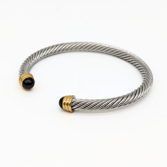 Stainless steel rope cuff bangle with black center and gold ring tips